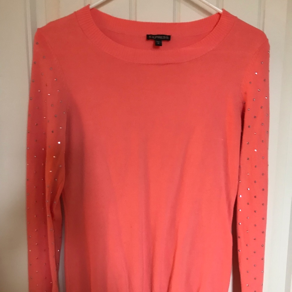 Coral sweater with sequin arm